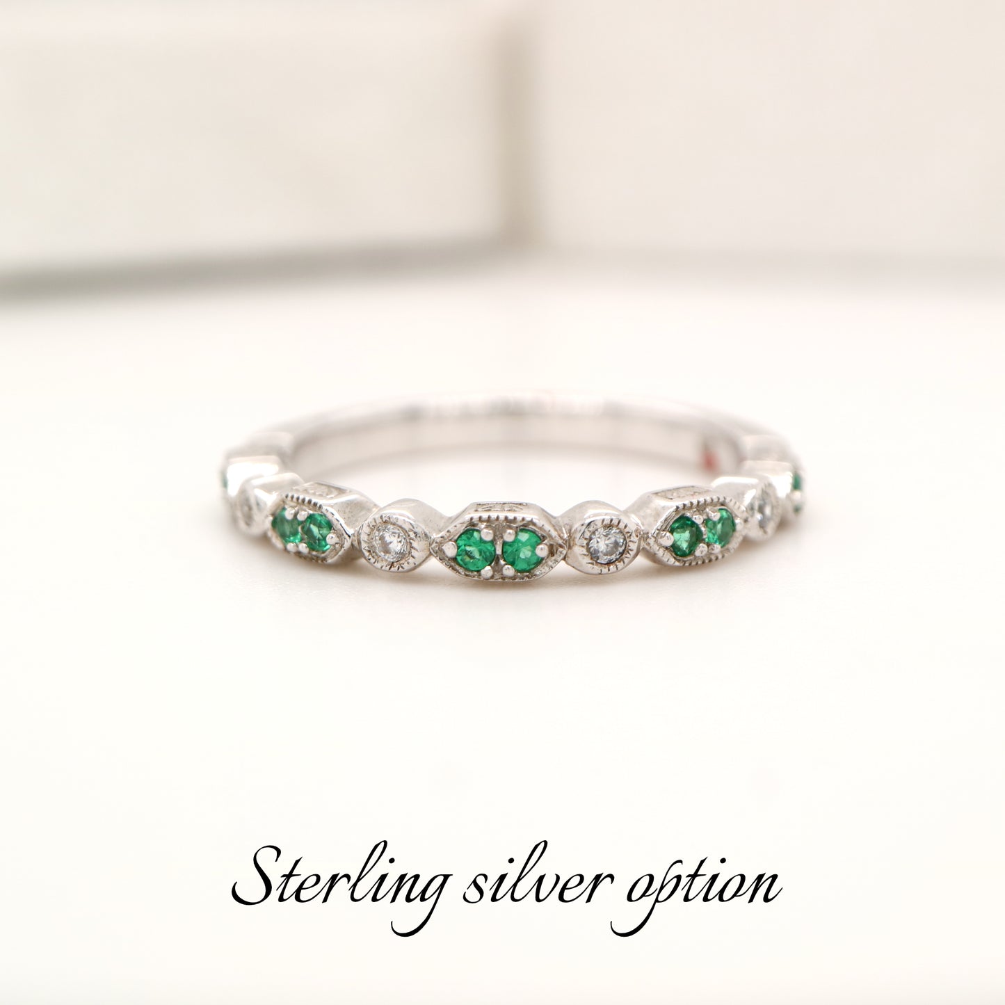 Paired laboratory grown emerald celebration band with cz in sterling silver
