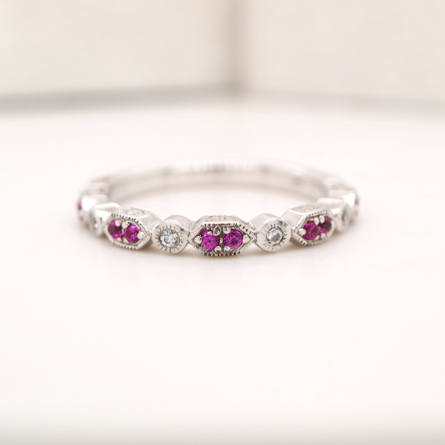 White gold, double ruby and diamond celebration band
