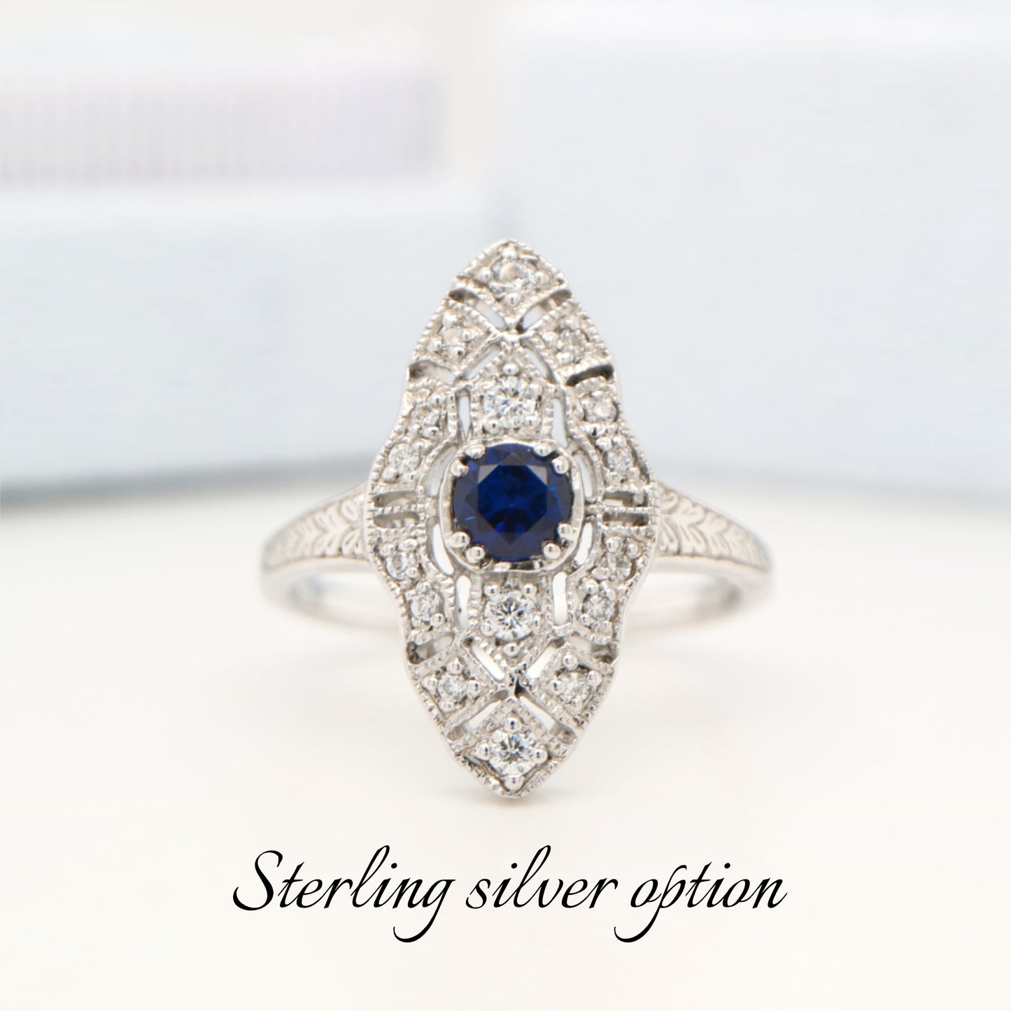 Art deco shield ring with laboratory grown sapphire and cz in sterling silver