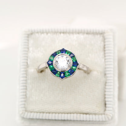 Diamond, emerald and sapphire target ring in white gold