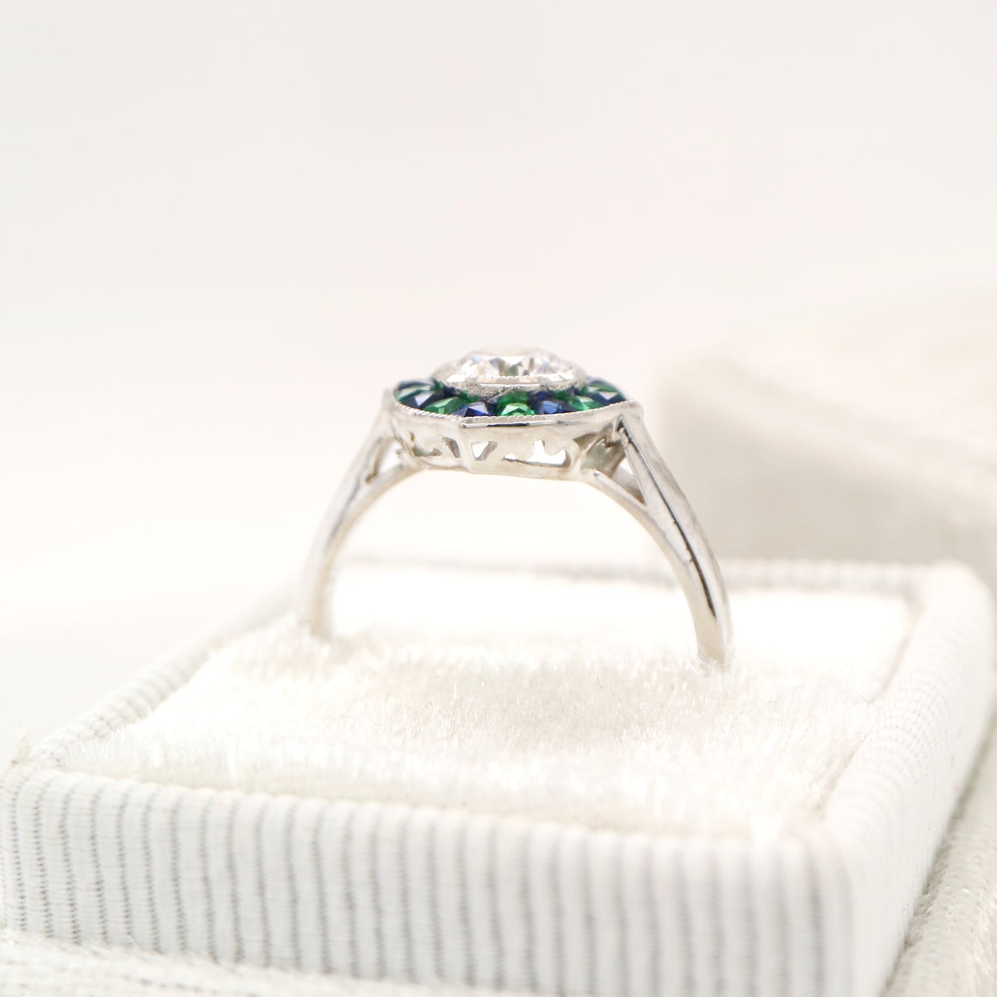 Diamond, emerald and sapphire target ring in white gold