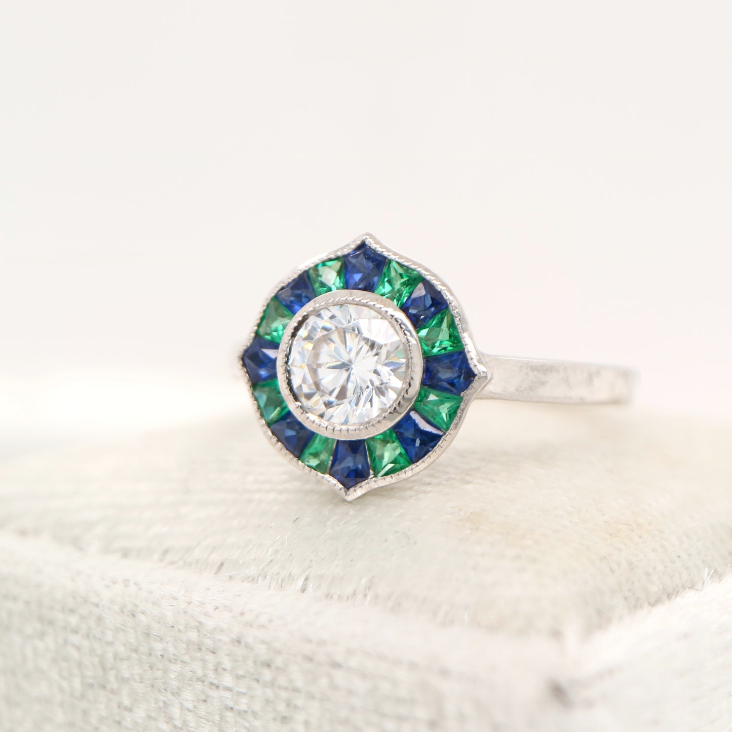 Diamond, emerald and sapphire target ring in white gold