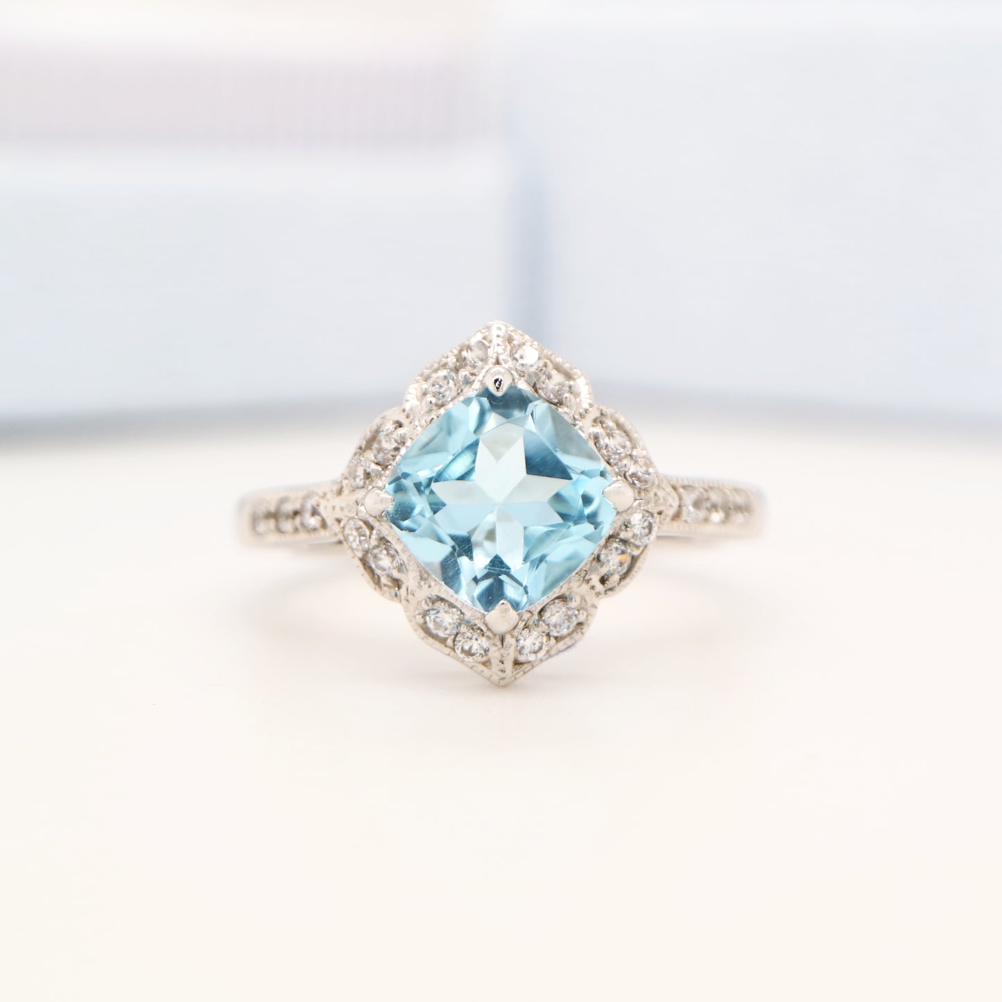 Aquamarine in 9k white gold with diamond halo