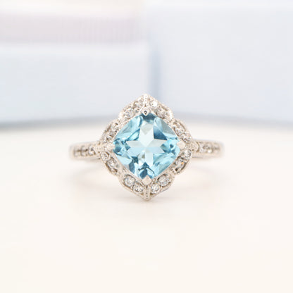 Aquamarine in 9k white gold with diamond halo