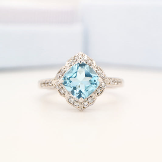 Aquamarine in 9k white gold with diamond halo