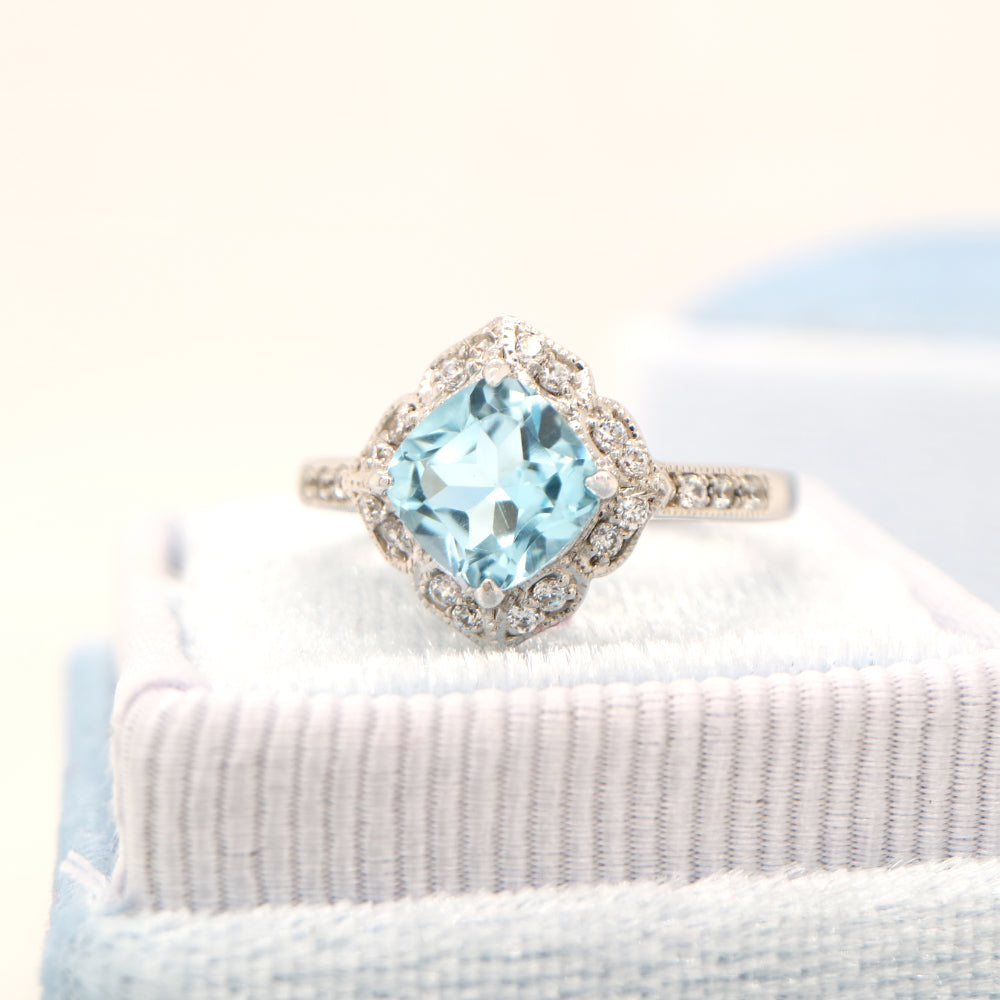 Aquamarine in 9k white gold with diamond halo
