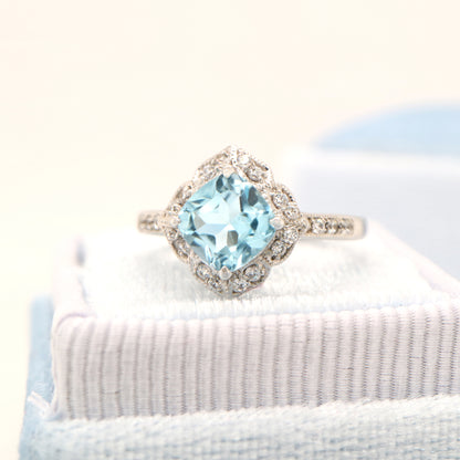 Aquamarine in 9k white gold with diamond halo