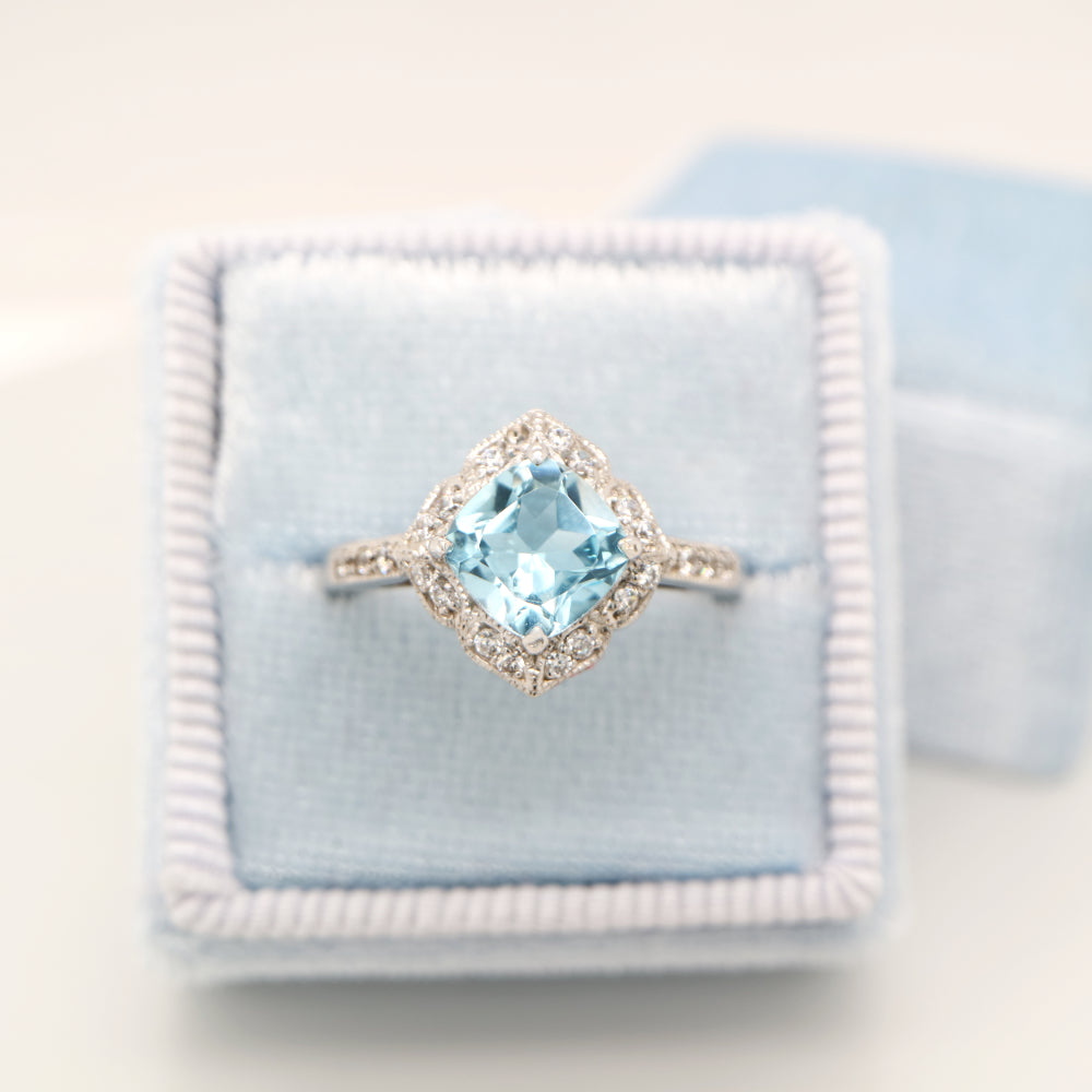 Aquamarine in 9k white gold with diamond halo