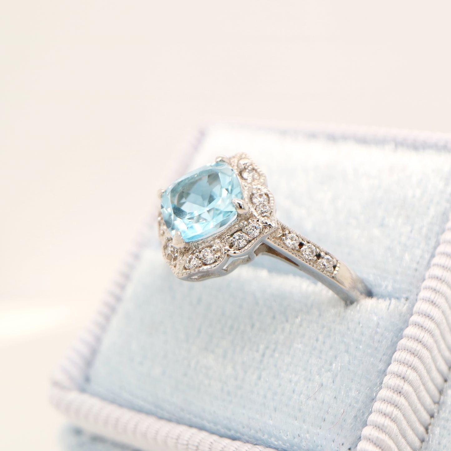 Aquamarine in 9k white gold with diamond halo