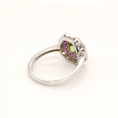 Peridot target ring with ruby and diamond halo in white gold
