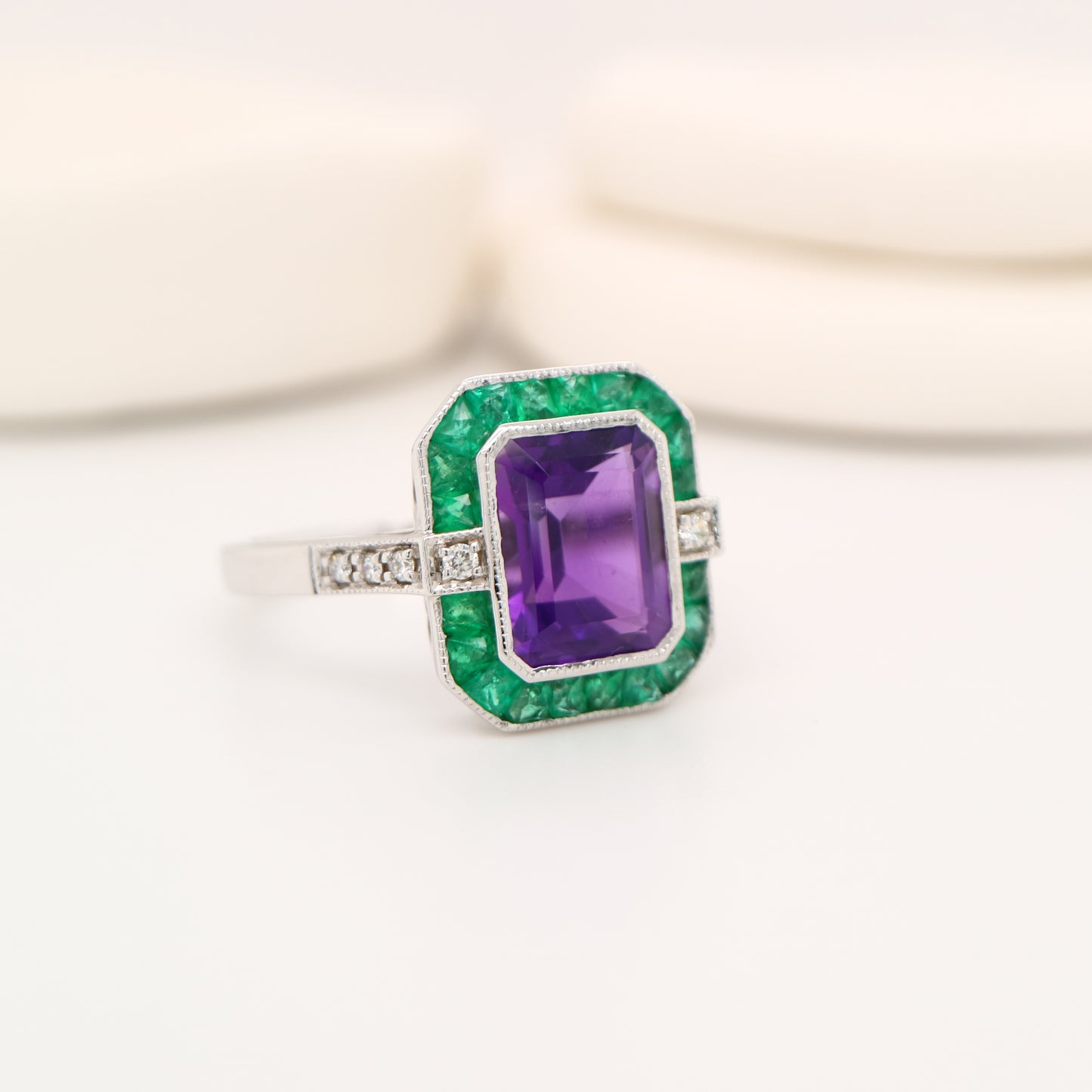 Amethyst and emerald cocktail ring in white gold with diamonds