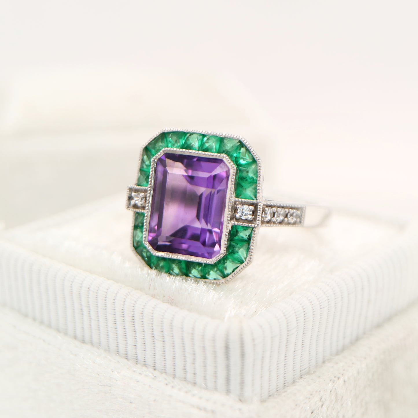 Amethyst and emerald cocktail ring in white gold with diamonds