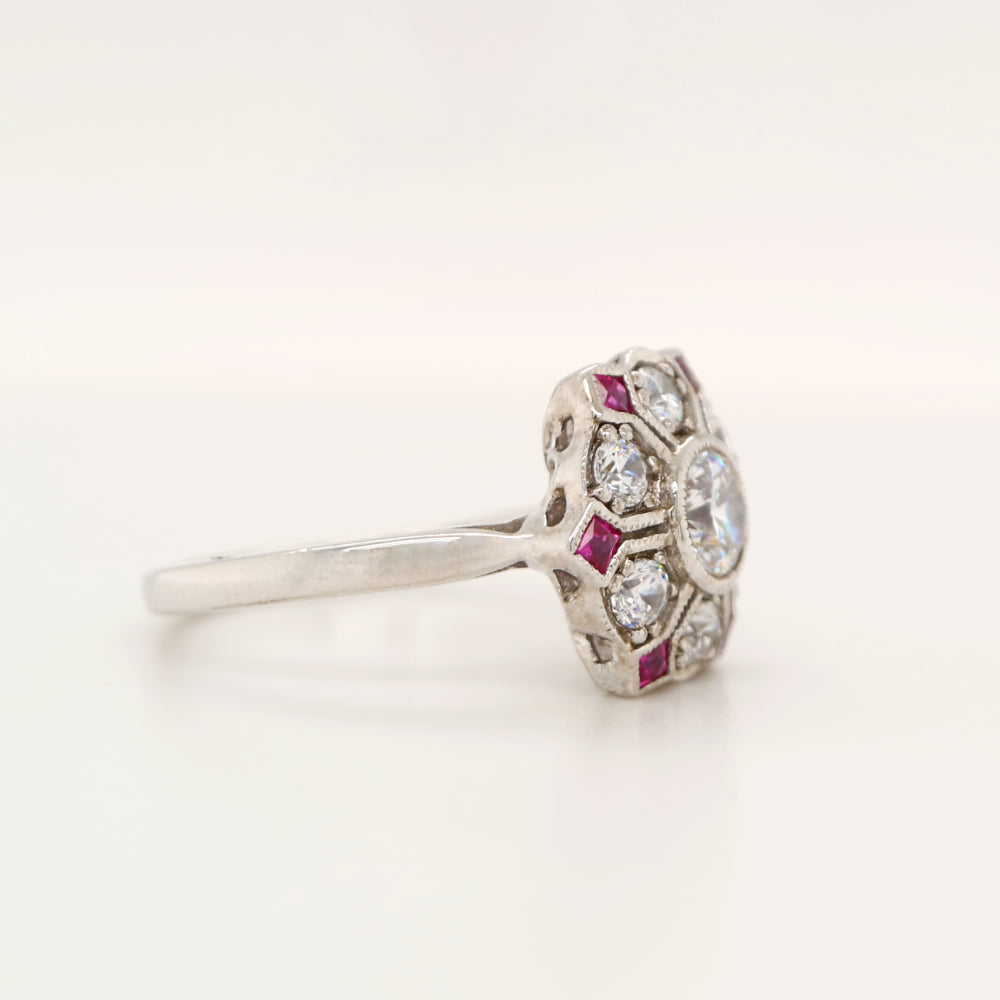 Six petal ruby and diamond ring in white gold