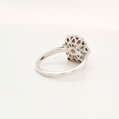 Six petal ruby and diamond ring in white gold