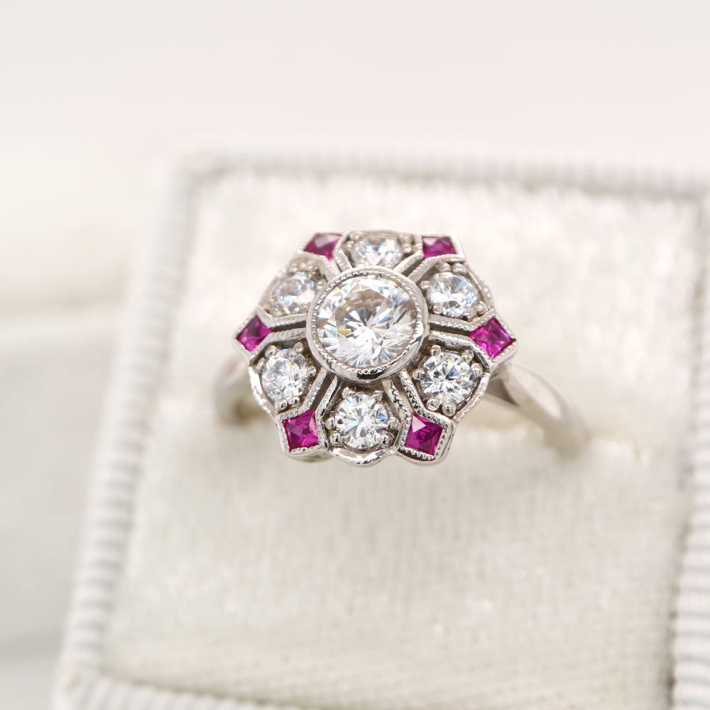 Six petal ruby and diamond ring in white gold