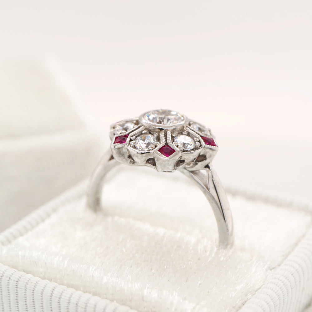Six petal ruby and diamond ring in white gold