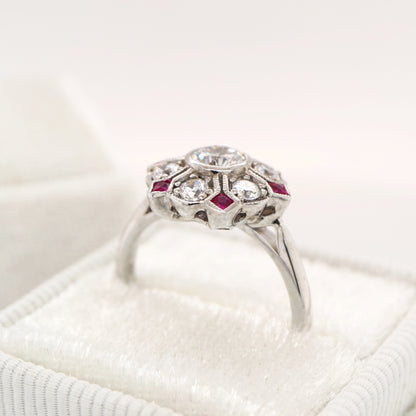 Six petal ruby and diamond ring in white gold