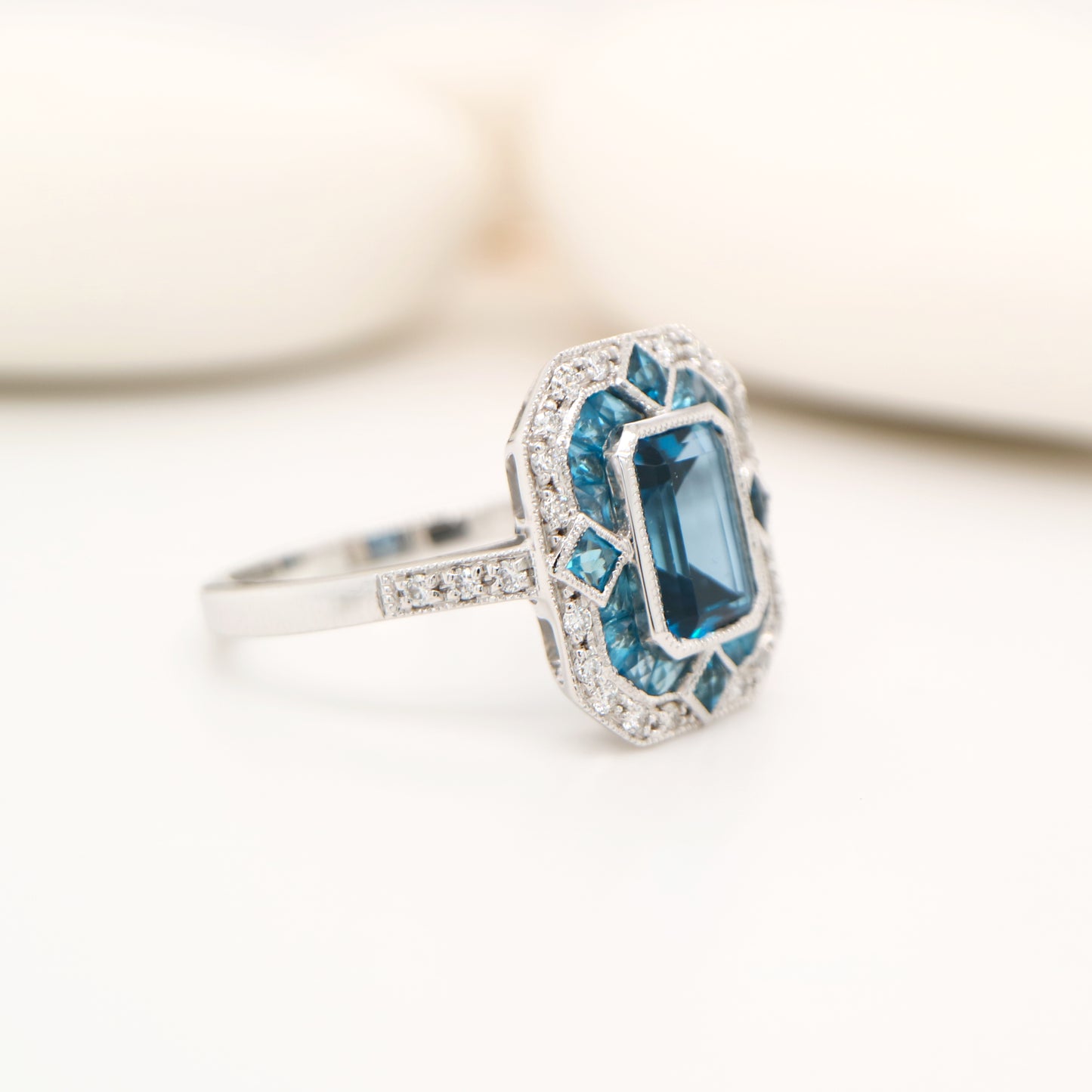 Art deco cocktail ring with london blue topaz and diamond in white gold
