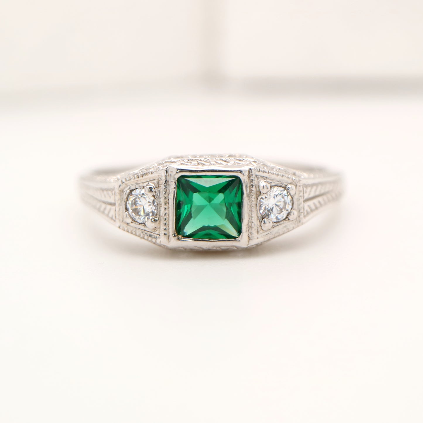 Art deco 9k white gold ring with center emerald and shoulder diamonds