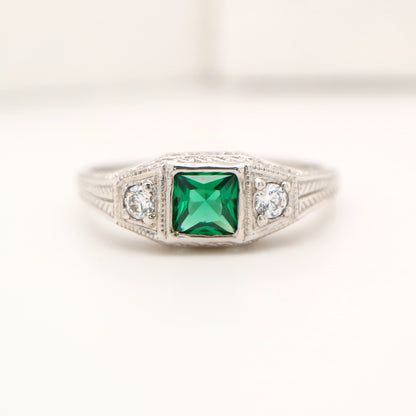 Art deco 9k white gold ring with center emerald and shoulder diamonds