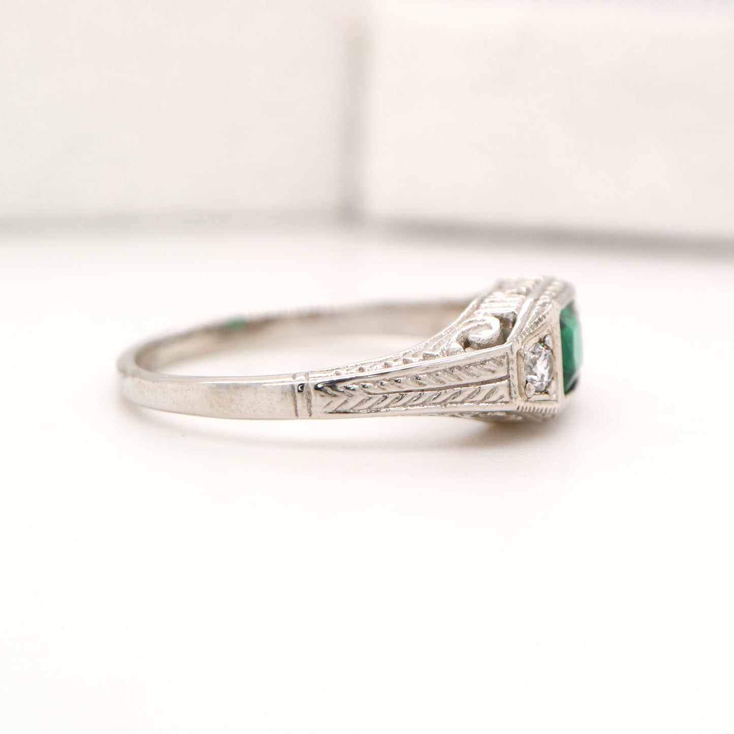 Art deco 9k white gold ring with center emerald and shoulder diamonds