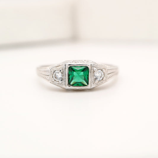 Art deco 9k white gold ring with center emerald and shoulder diamonds