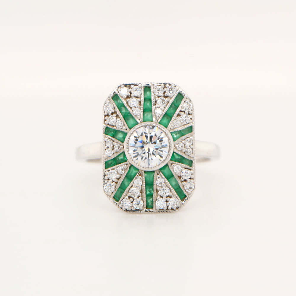 Square shield ring in white gold with emerald and diamond