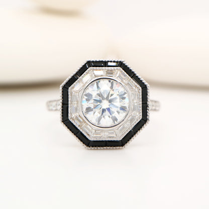 Moissanite target ring with moissanite and onyx halo in white gold