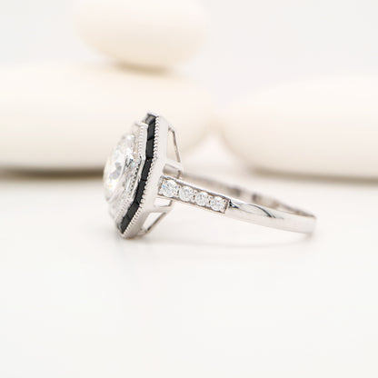 Moissanite target ring with moissanite and onyx halo in white gold