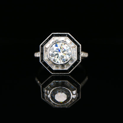 Moissanite target ring with moissanite and onyx halo in white gold