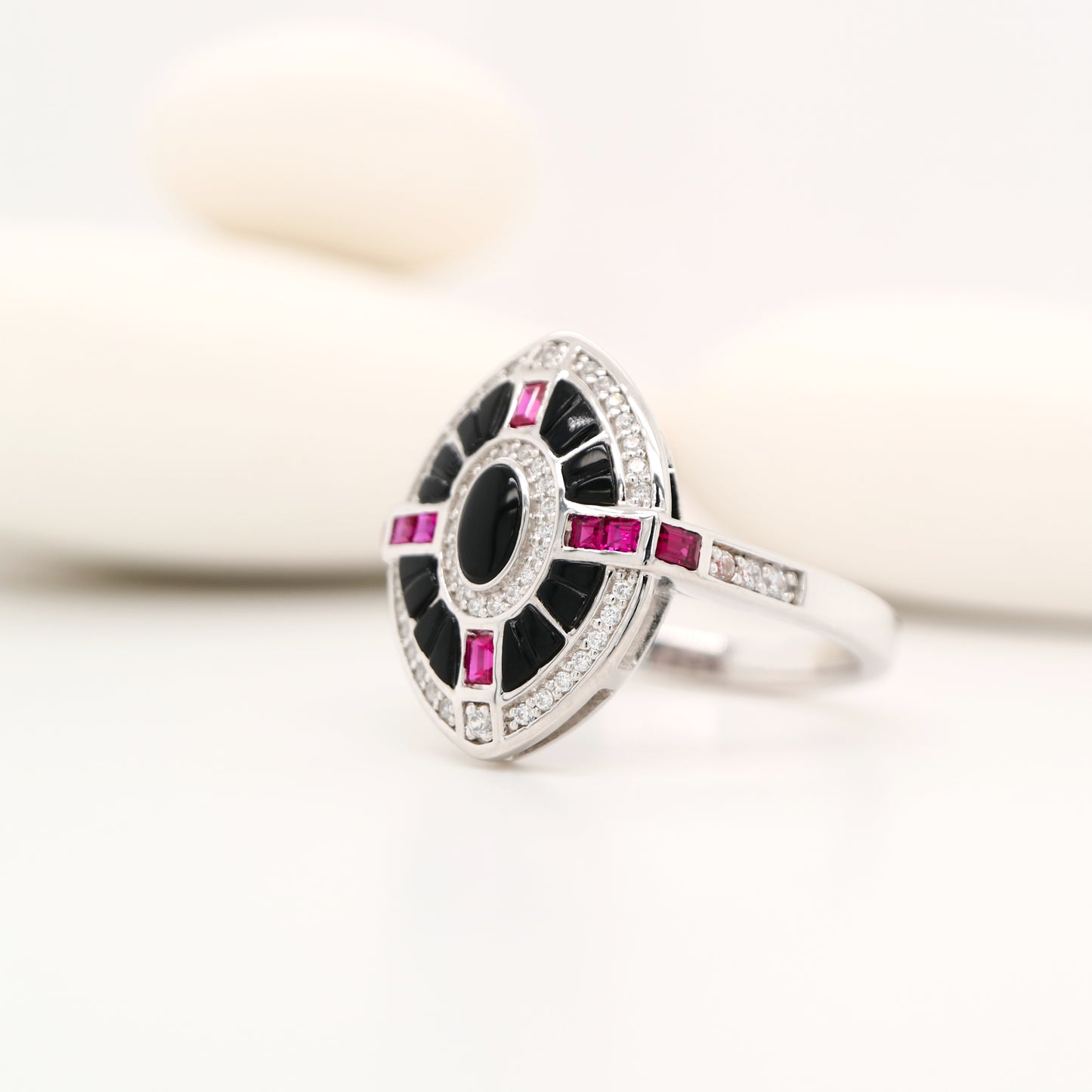 Onyx, ruby and diamond shield target ring in white gold