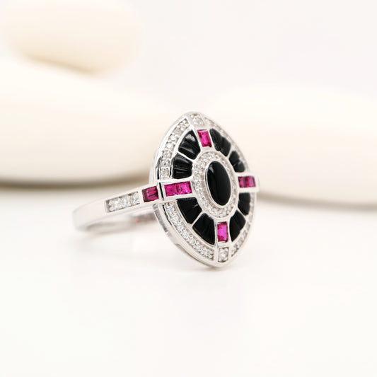 Onyx, ruby and diamond shield target ring in white gold