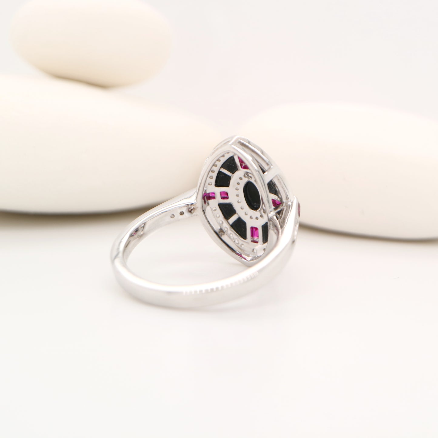 Onyx, ruby and diamond shield target ring in white gold