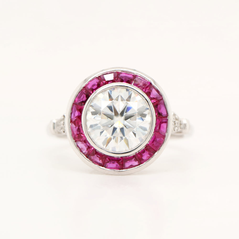 Moissanite with ruby halo ring in white gold