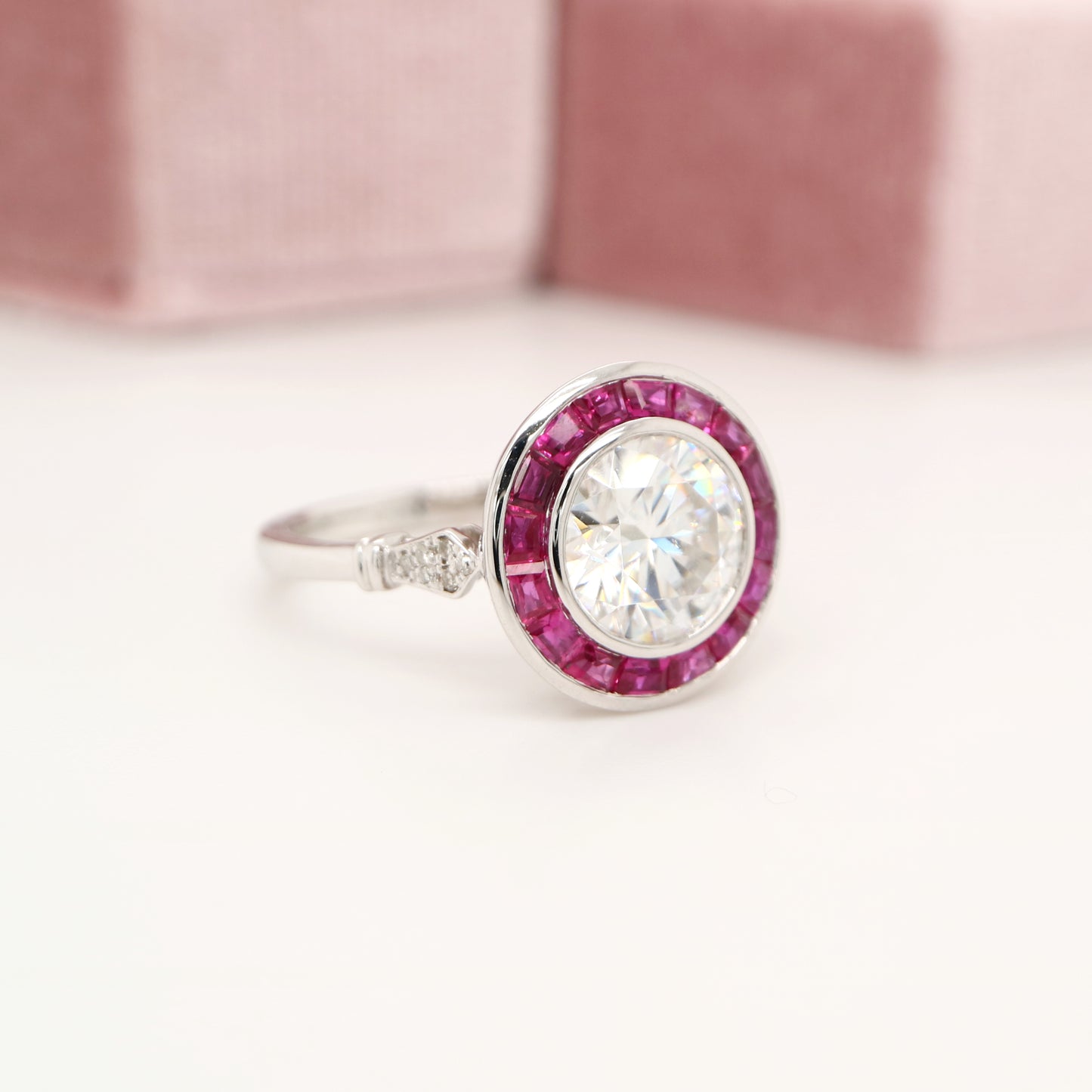 Moissanite with ruby halo ring in white gold