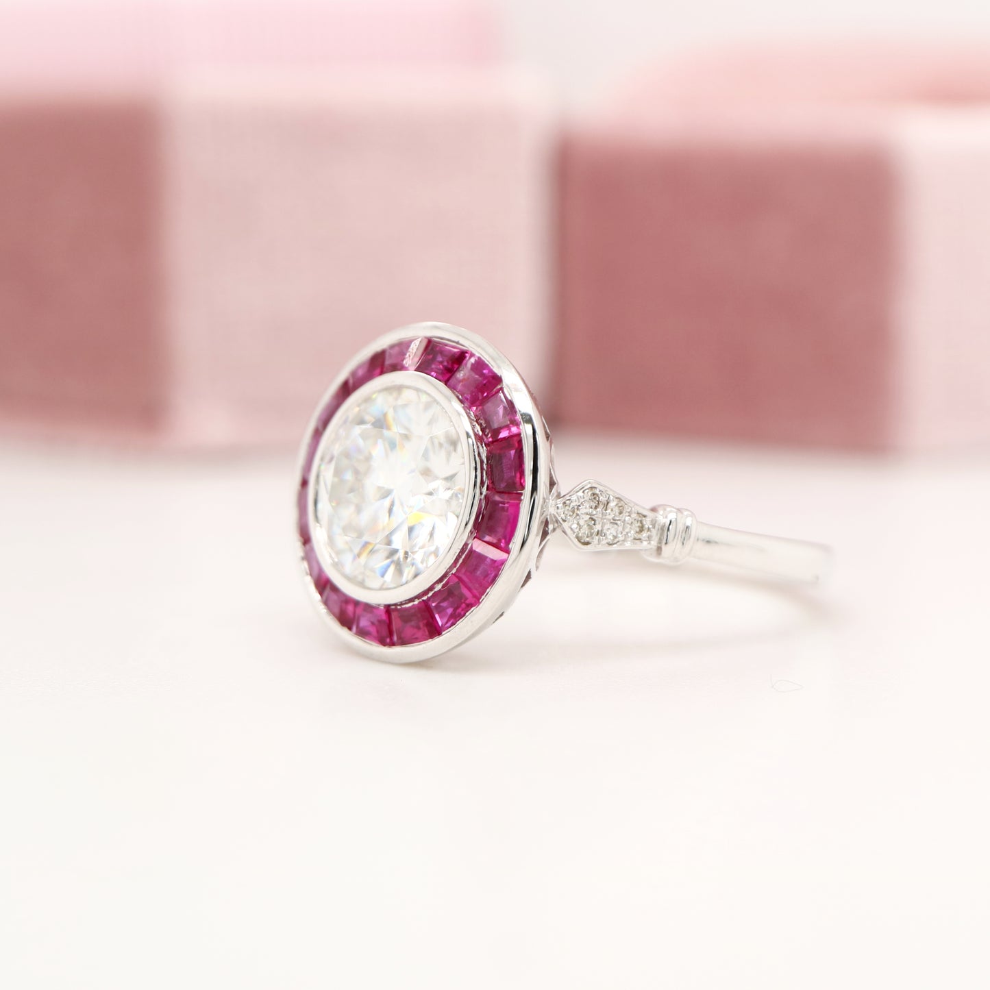 Moissanite with ruby halo ring in white gold