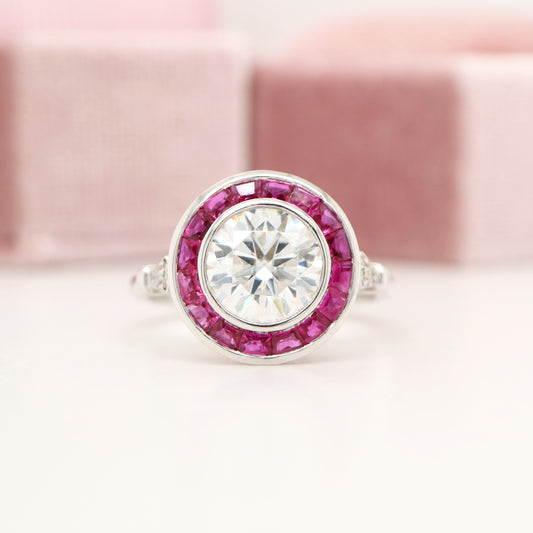 Moissanite with ruby halo ring in white gold