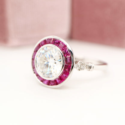 Moissanite with ruby halo ring in white gold