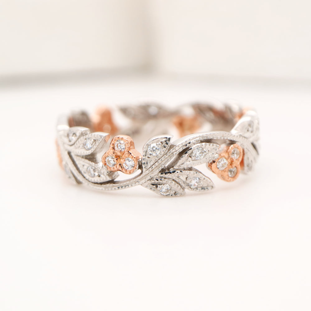 Diamond ring with white gold vine and rose gold berries