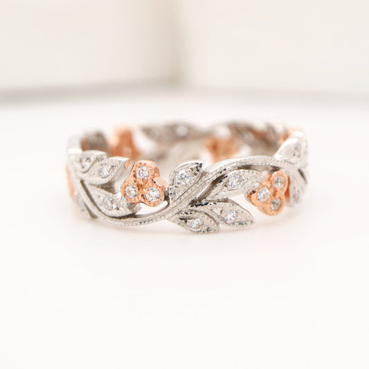 Diamond ring with white gold vine and rose gold berries