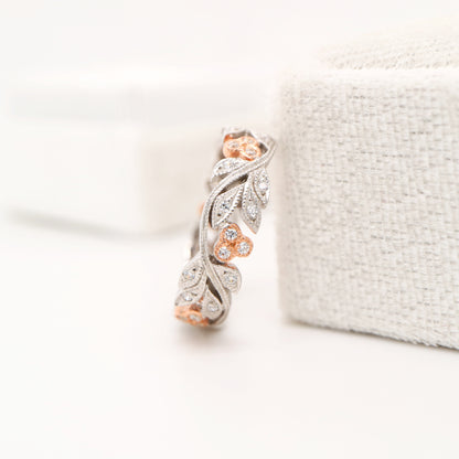 Diamond ring with white gold vine and rose gold berries