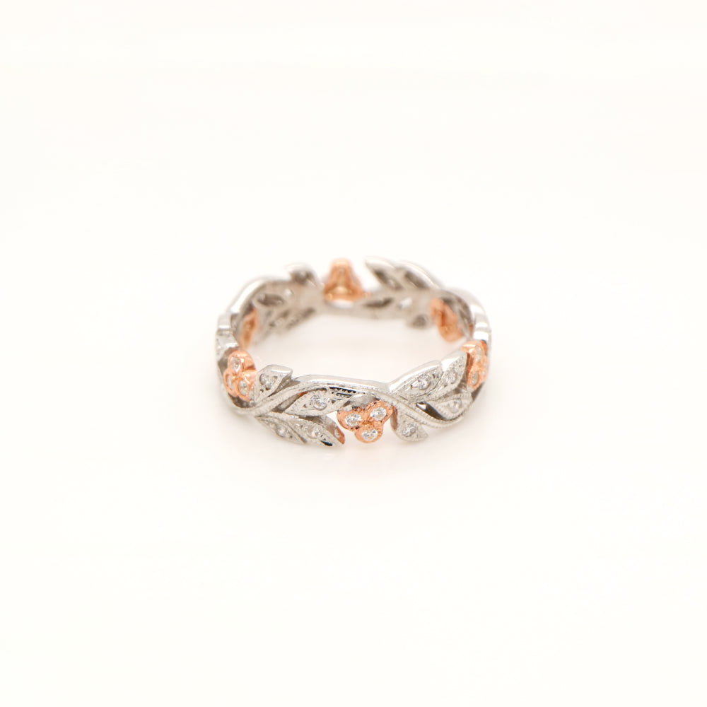 Diamond ring with white gold vine and rose gold berries