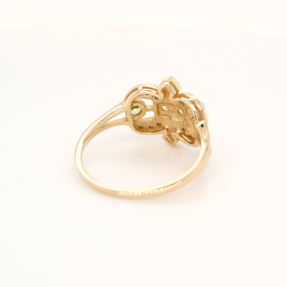 Gold fleur-de-lis ring with peridot and pearl