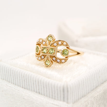 Gold fleur-de-lis ring with peridot and pearl