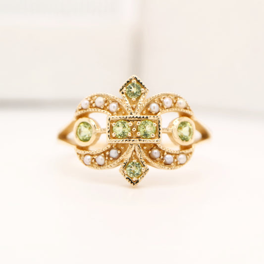 Gold fleur-de-lis ring with peridot and pearl