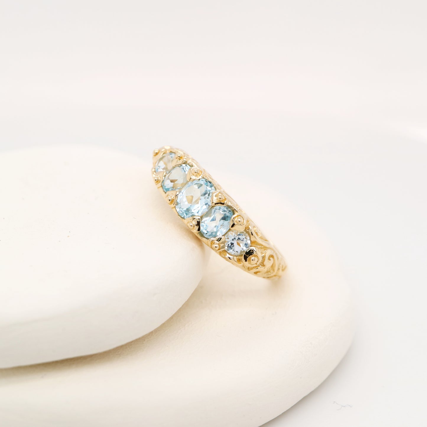 Vintage cascading sky blue topaz ring in yellow gold