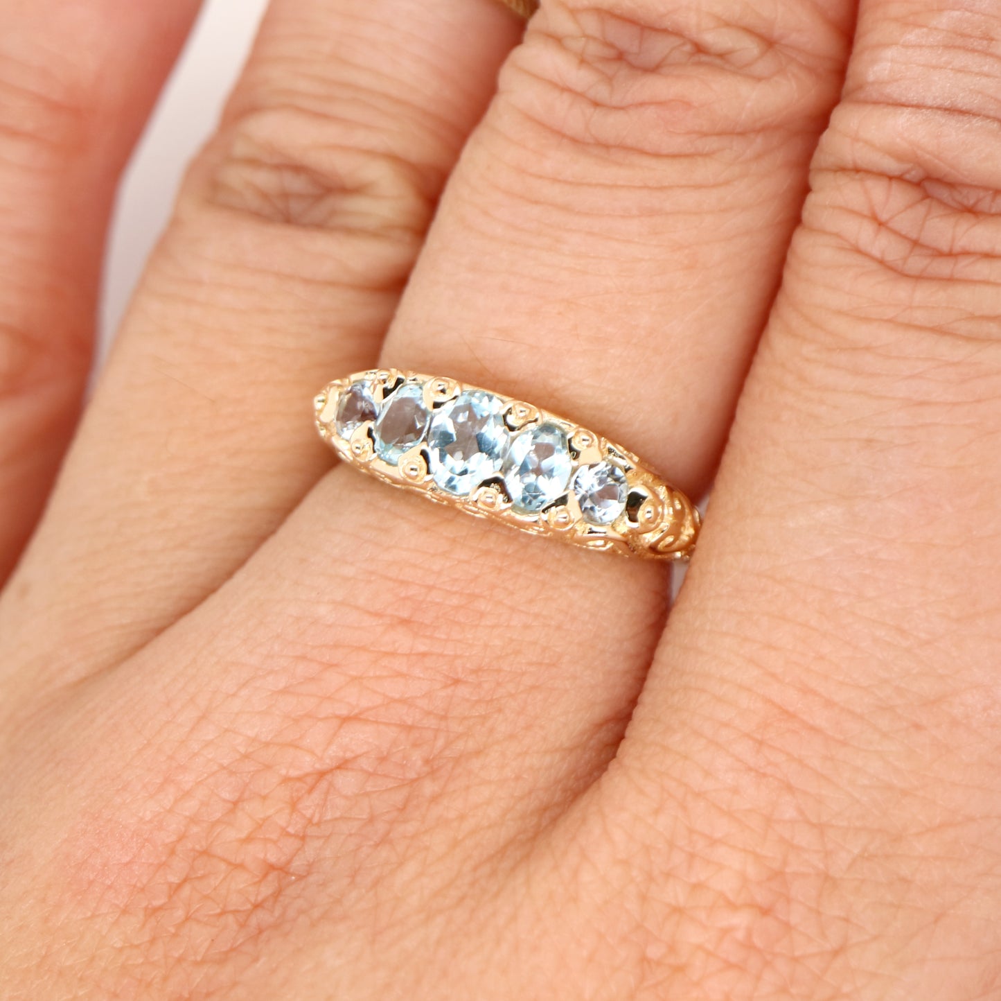 Vintage cascading sky blue topaz ring in yellow gold