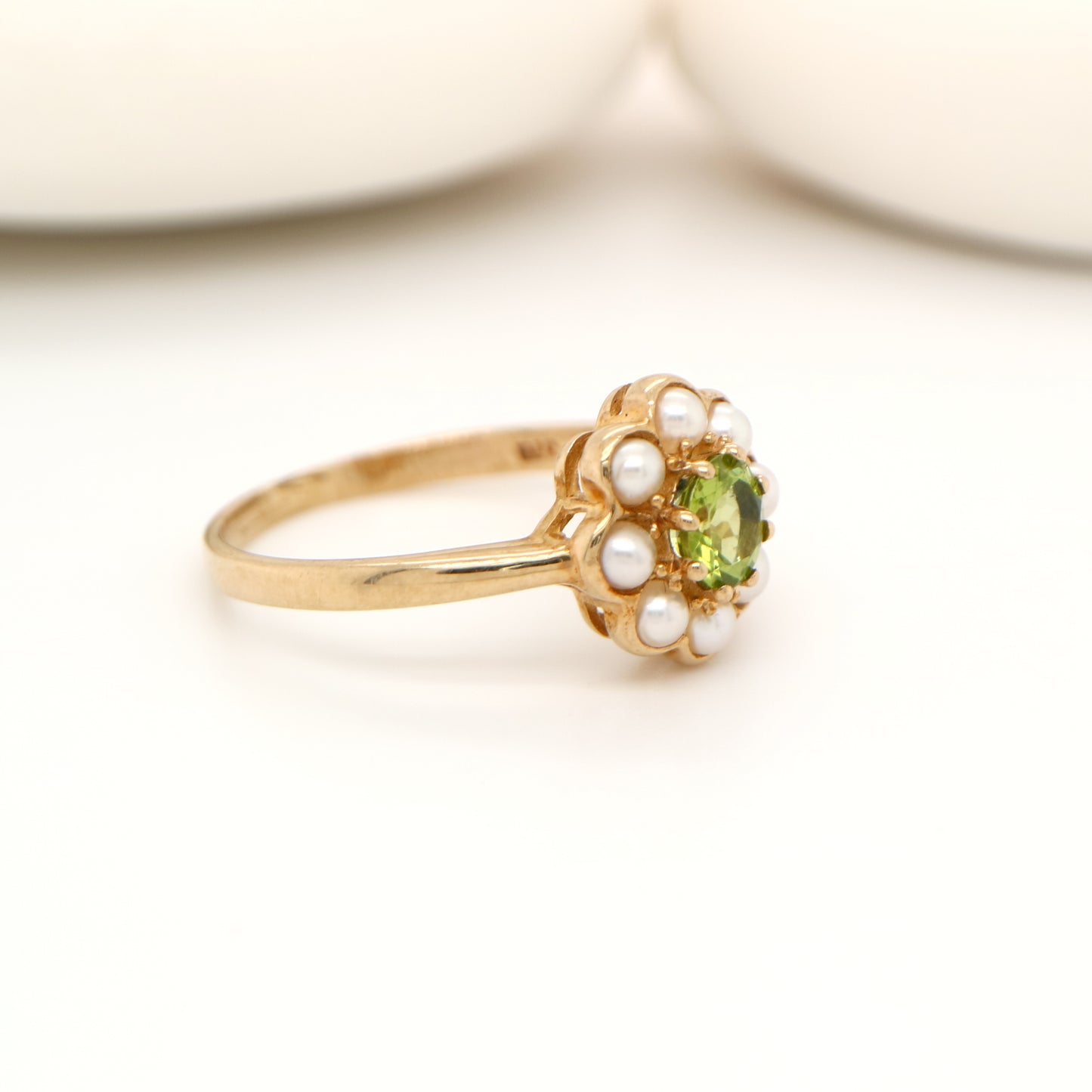 Peridot with pearl halo ring in 9k yellow gold