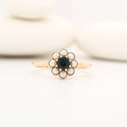 Blue sapphire with pearl halo ring in 9k yellow gold