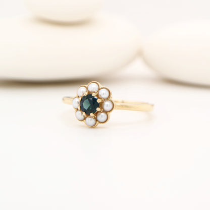 Blue sapphire with pearl halo ring in 9k yellow gold